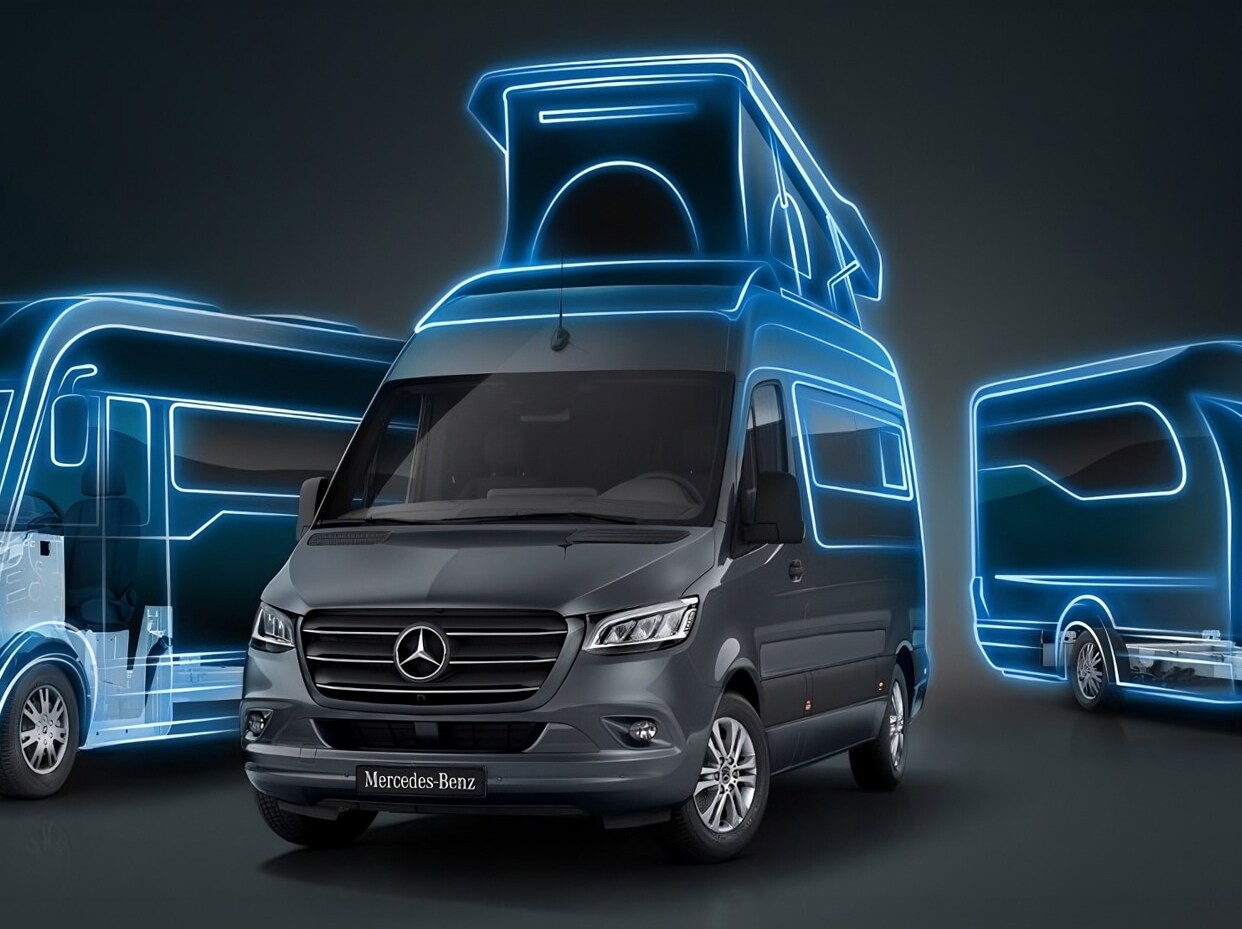 Un camper Mercedes-Benz Sprinter parcheggiato in riva a un fiume panoramico.